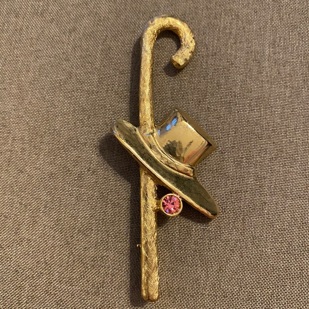 Vintage brass pin, cane and hat